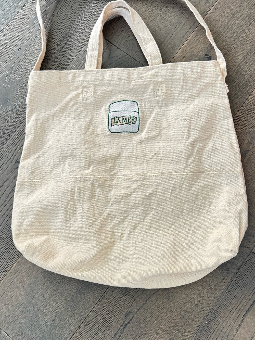 La Mer canvas tote with hand and shoulder strap. Like new
